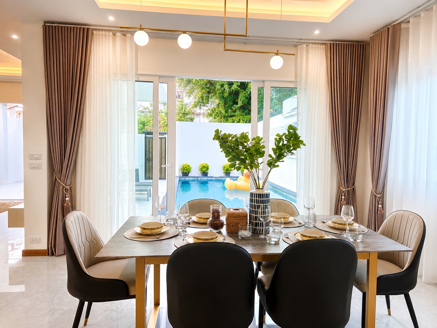 Dining room overlooking the private pool
