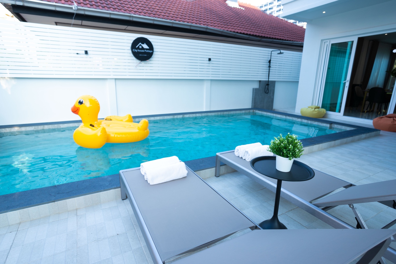 Private swimming pool and loungers